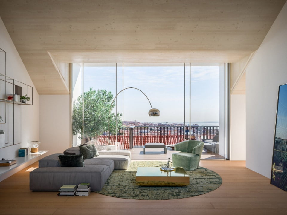 Modern living room with large windows and greenery.