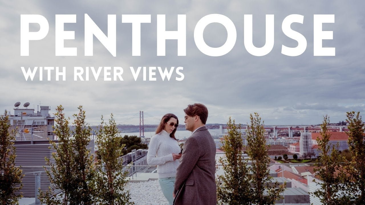 Couple enjoying penthouse river views