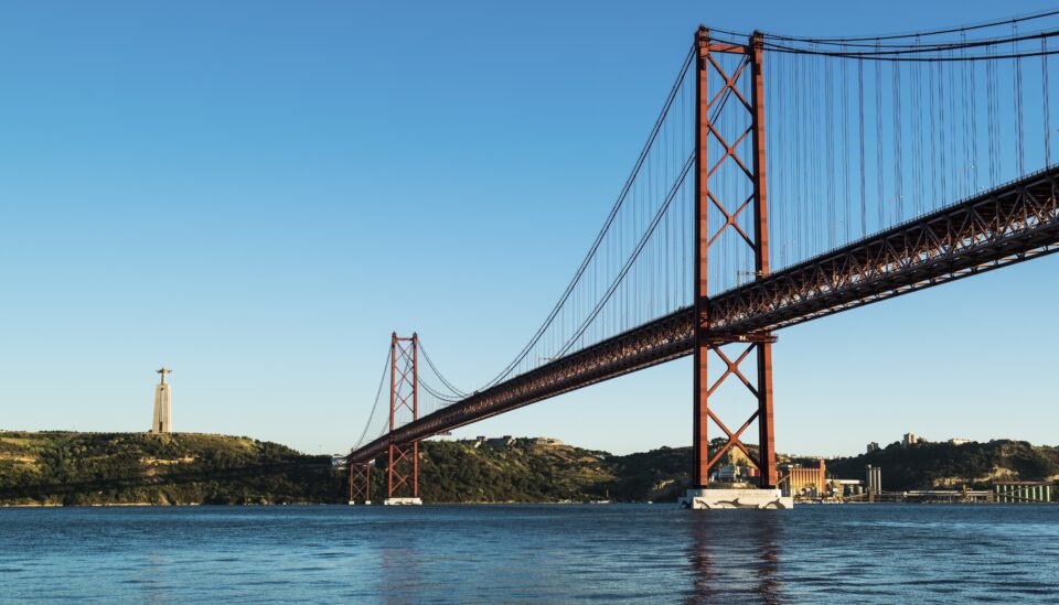 Lisbon's iconic bridge against a clear sky