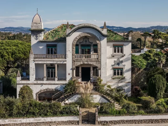 Historic villa with decorative architecture and gardens.