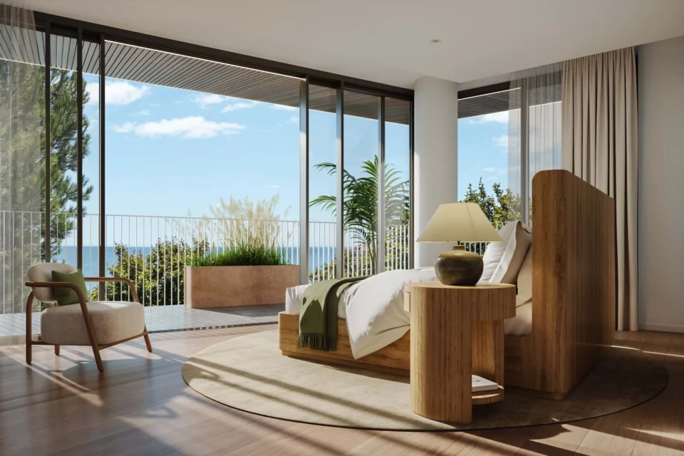 Stylish bedroom with coastal view and modern decor.