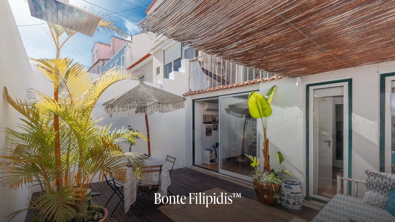 Relaxing outdoor space with tropical plants and shade.