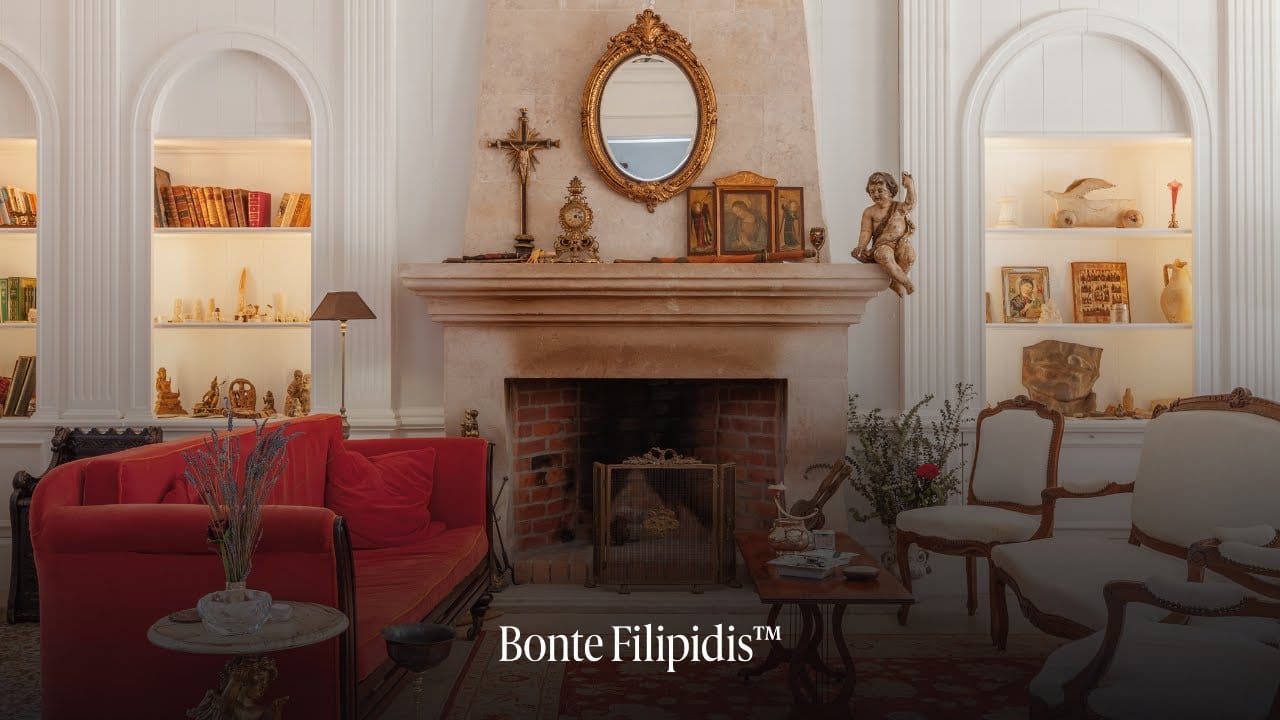 Elegant living room with antique decor and fireplace.