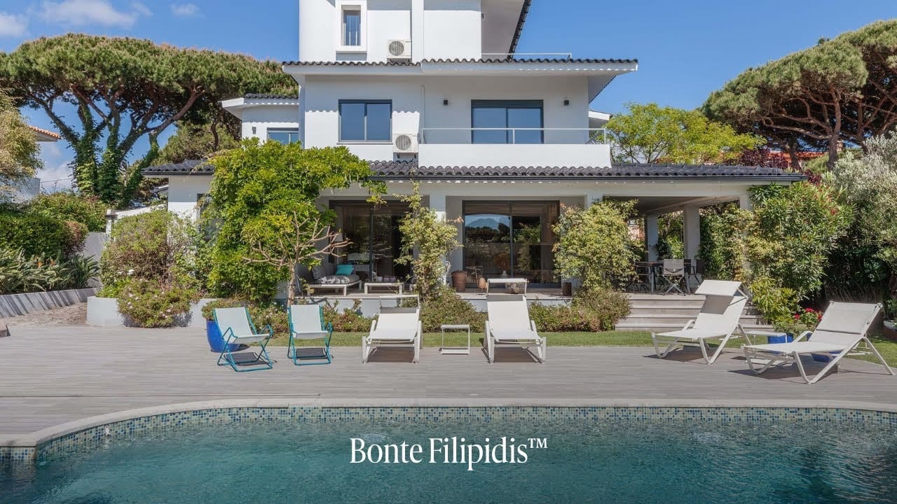 Modern villa with pool and garden area.