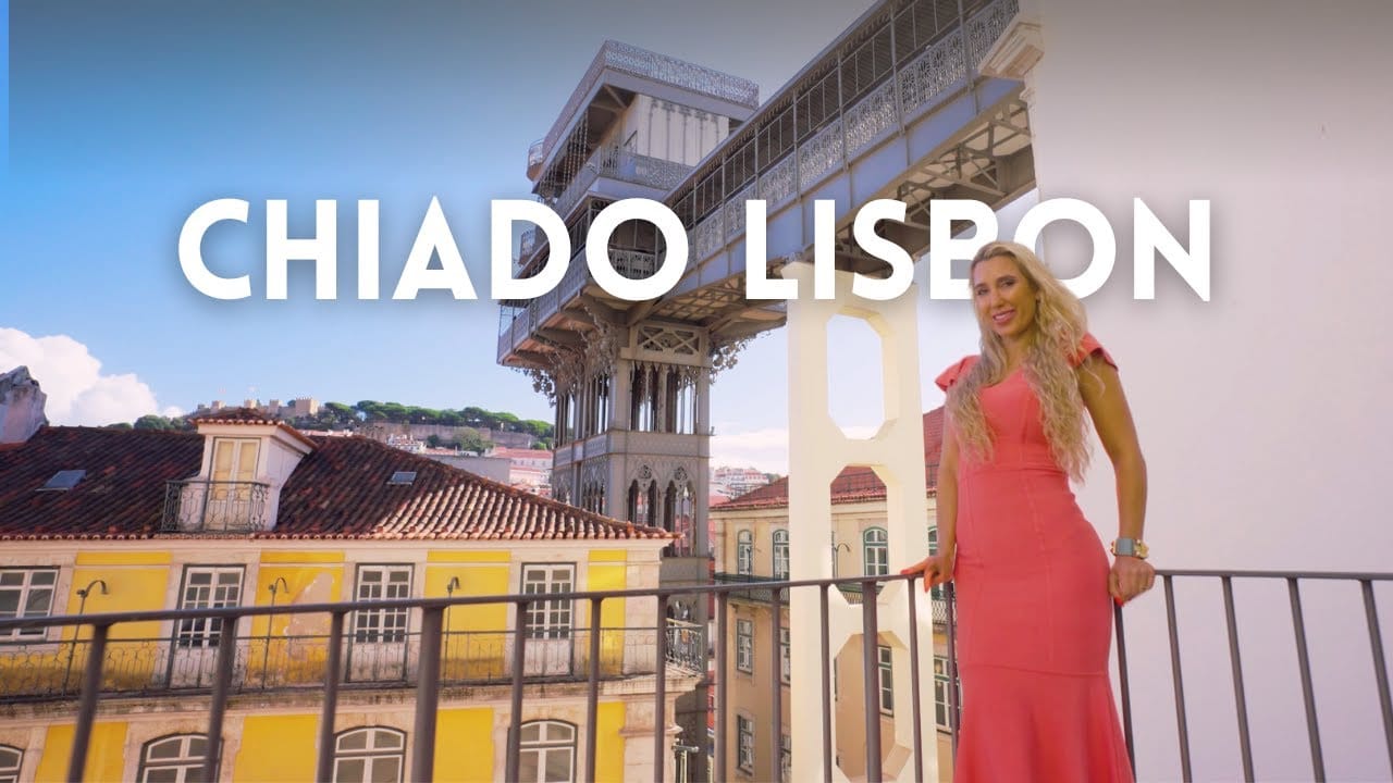 View of Chiado, Lisbon with woman in pink dress.