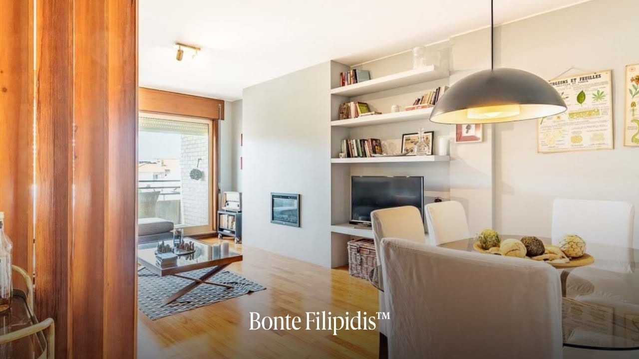 Modern living room with wooden accents and natural light.